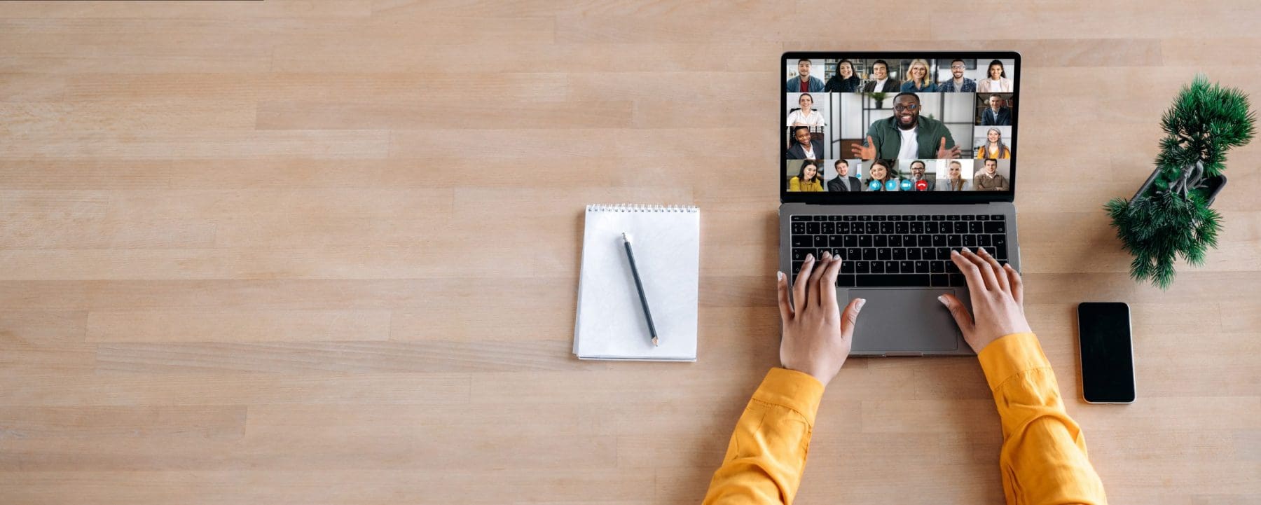 Panoramic photo of laptop screen with webcam shots of multi ethnic business partners