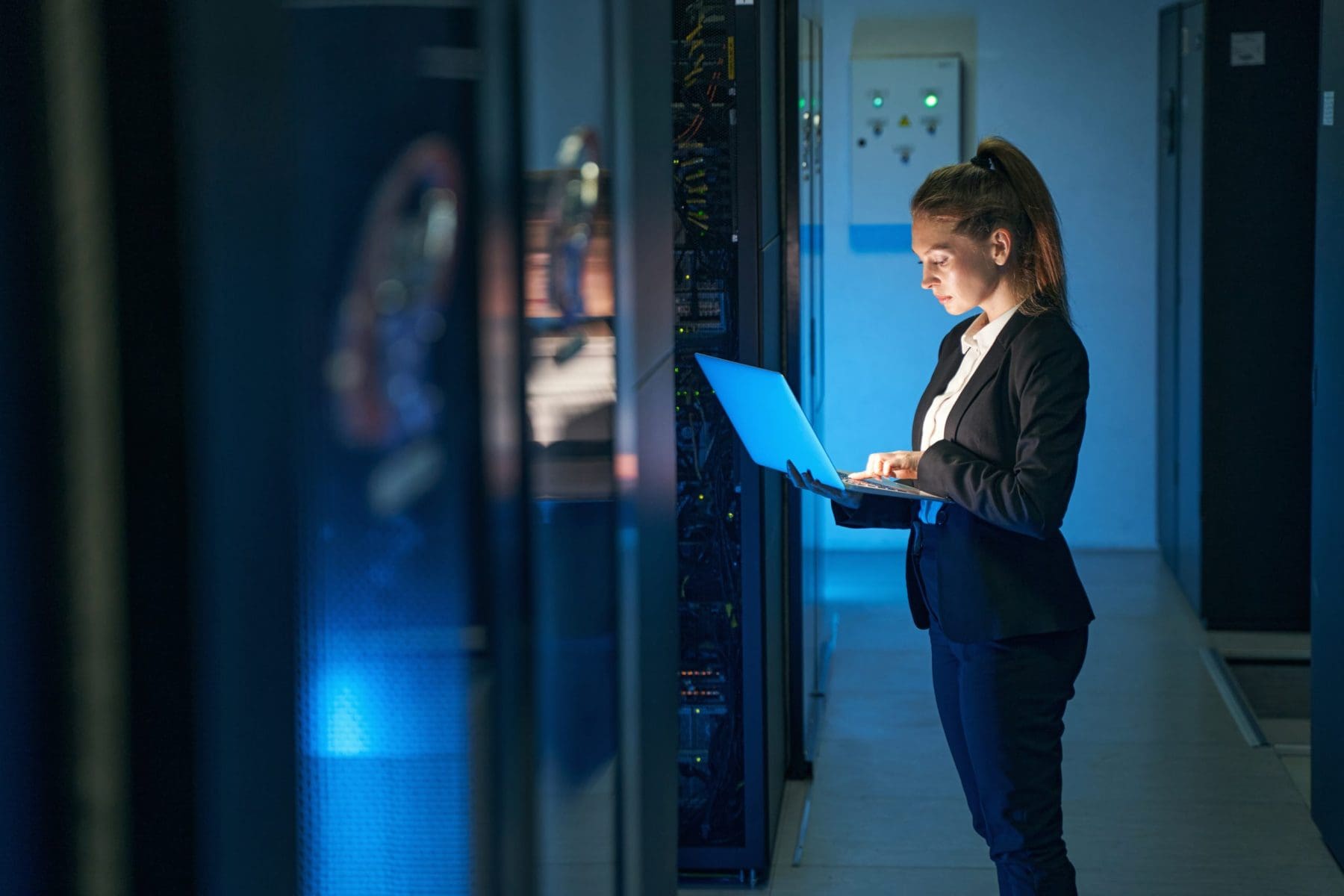 Woman in elegant suit working on computer.