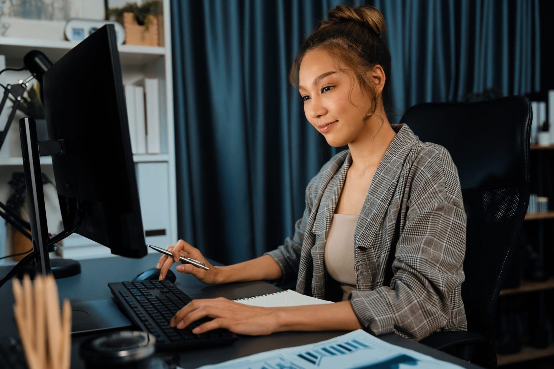 Businesswoman working on laptop.