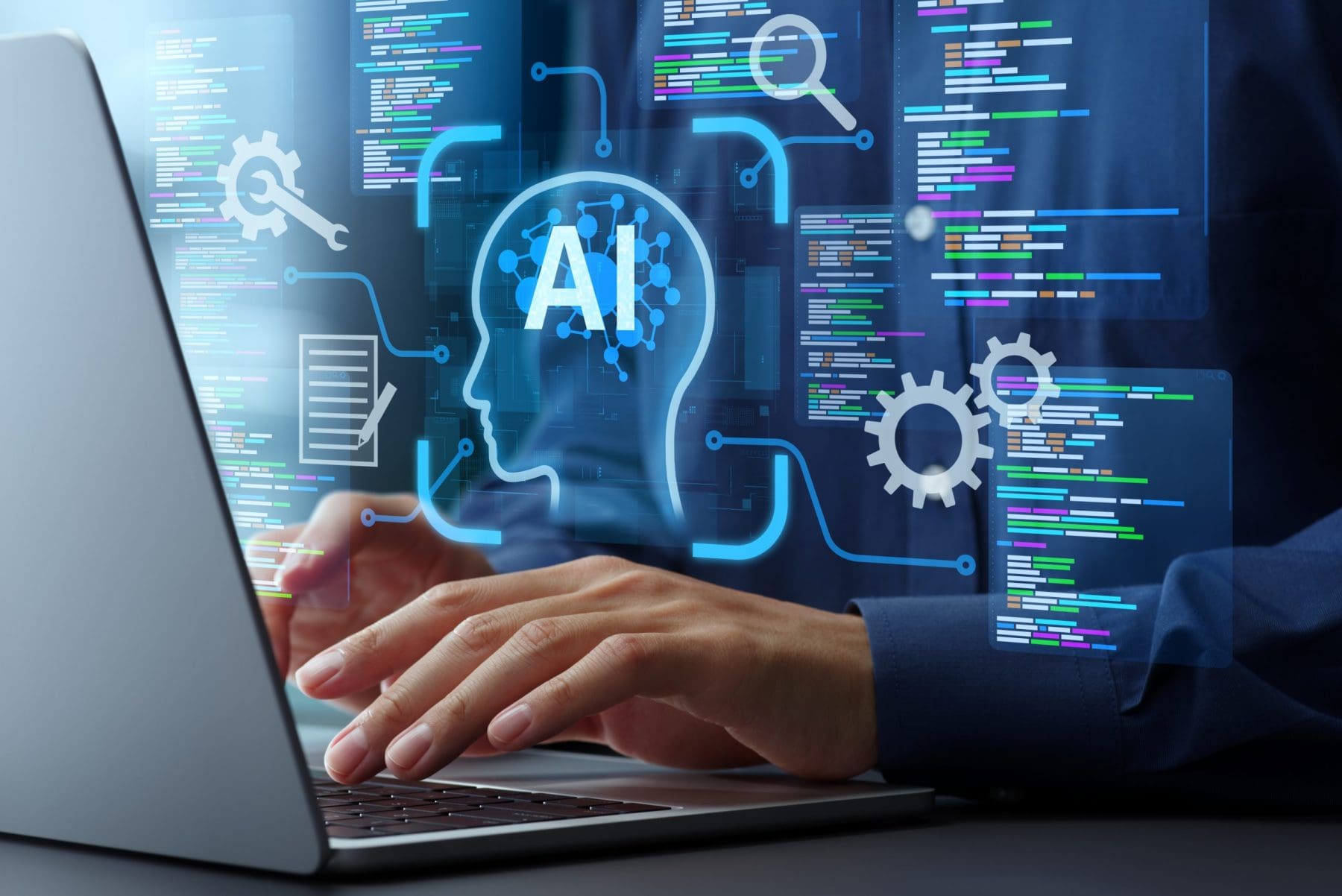 Person writing on laptop with AI tools.