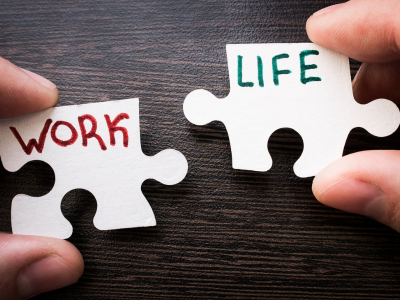 Two puzzle pieces with words work and life