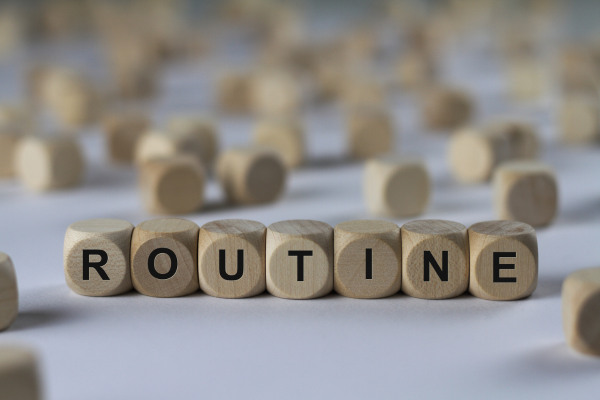 Wooden squares with word: routine