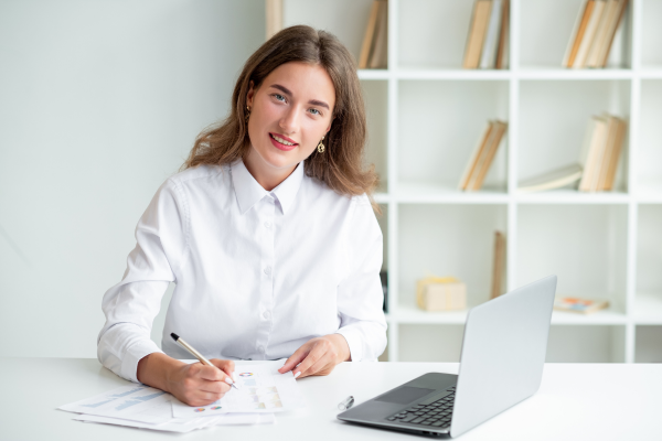 Woman working from home on laptop.